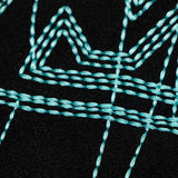 Close-up detail shot of Louis Vuitton luxury clothing with label-forward styling