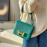 Side view of streamlined structured handbag