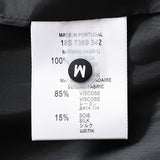 Close-up detail shot of Louis Vuitton luxury clothing with signature branding