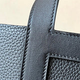 Side view of clean-lined structured handbag