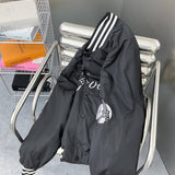 Close-up detail shot of Louis Vuitton luxury clothing with label-forward styling