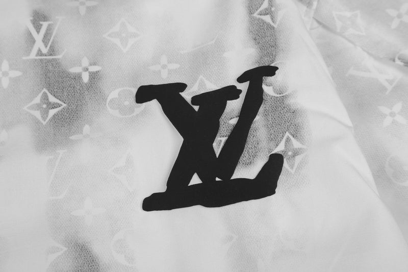 Flat lay presentation of Louis Vuitton luxury clothing with logo-detail design