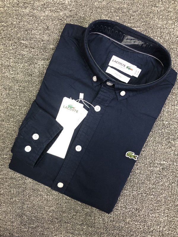Flat lay presentation of Lacoste luxury clothing with logo-detail design