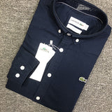 Flat lay presentation of Lacoste luxury clothing with logo-detail design