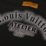 Close-up detail shot of Louis Vuitton luxury clothing with logo-detail design