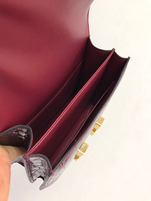 Side view of poised structured handbag