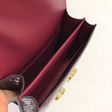 Side view of poised structured handbag