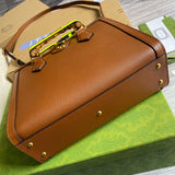 Handle and strap detail of classic chic women's handbag – women's statement bag