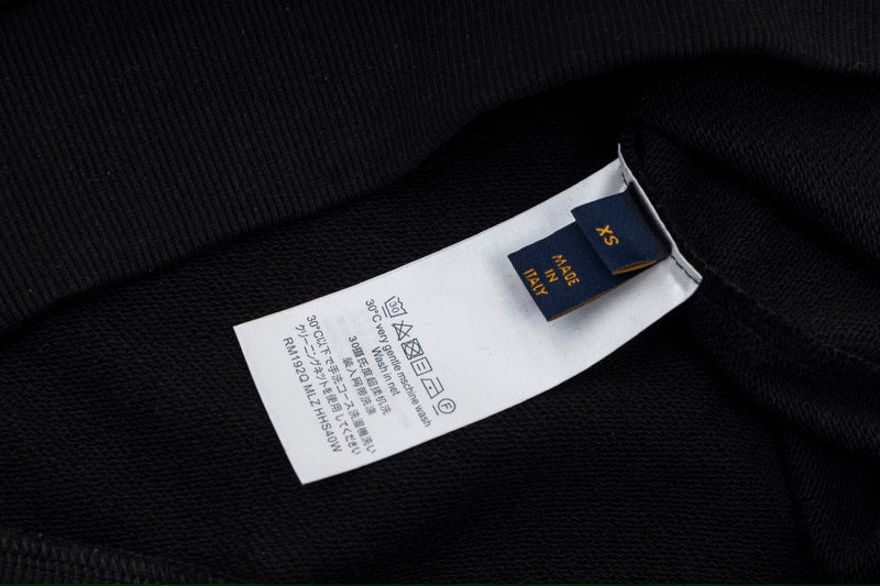 Close-up detail shot of Louis Vuitton luxury clothing with everyday silhouette