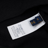 Close-up detail shot of Louis Vuitton luxury clothing with everyday silhouette