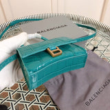 Styled lifestyle shot of structured classic women's handbag – women's premium purse