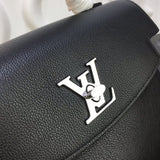 Back view of polished signature women's handbag – women's designer-style accessory