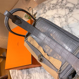  Sleek structured bag carried on shoulder 28