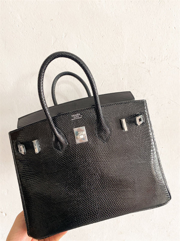 Side view of graceful structured handbag