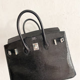 Side view of graceful structured handbag