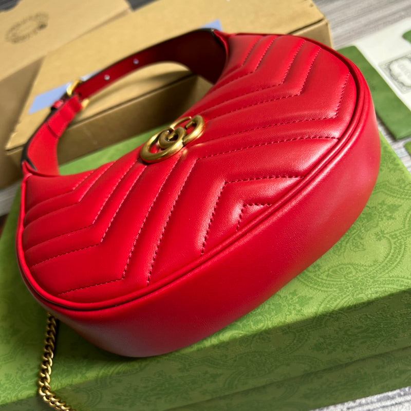 Side profile of polished signature women's handbag – women's luxury handbag