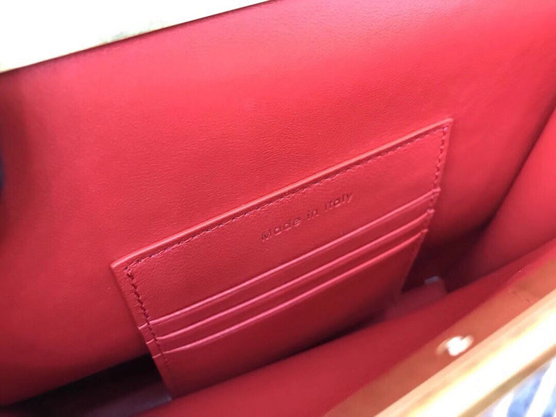 Side profile of sleek chic women's handbag – women's luxury accessory