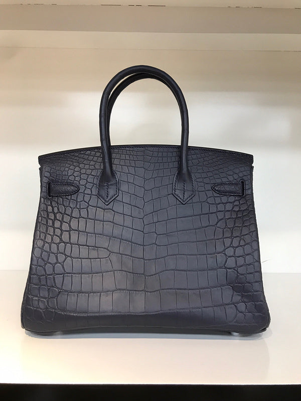 Close-up detail of poised bag design
