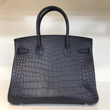 Close-up detail of poised bag design