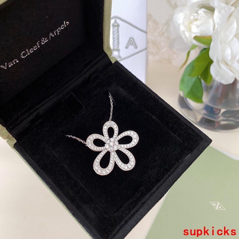 Lifestyle view of Van Cleef & Arpels unisex jewelry piece