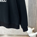Back view of Louis Vuitton luxury clothing with label-forward styling