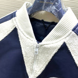 Side profile of Louis Vuitton luxury clothing with label-forward styling