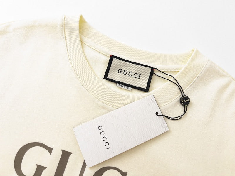 Flat lay presentation of Gucci luxury clothing with runway-inspired design