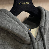 Close-up detail shot of Louis Vuitton luxury clothing with signature branding