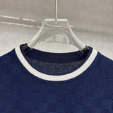 Close-up detail shot of Louis Vuitton luxury clothing with signature branding