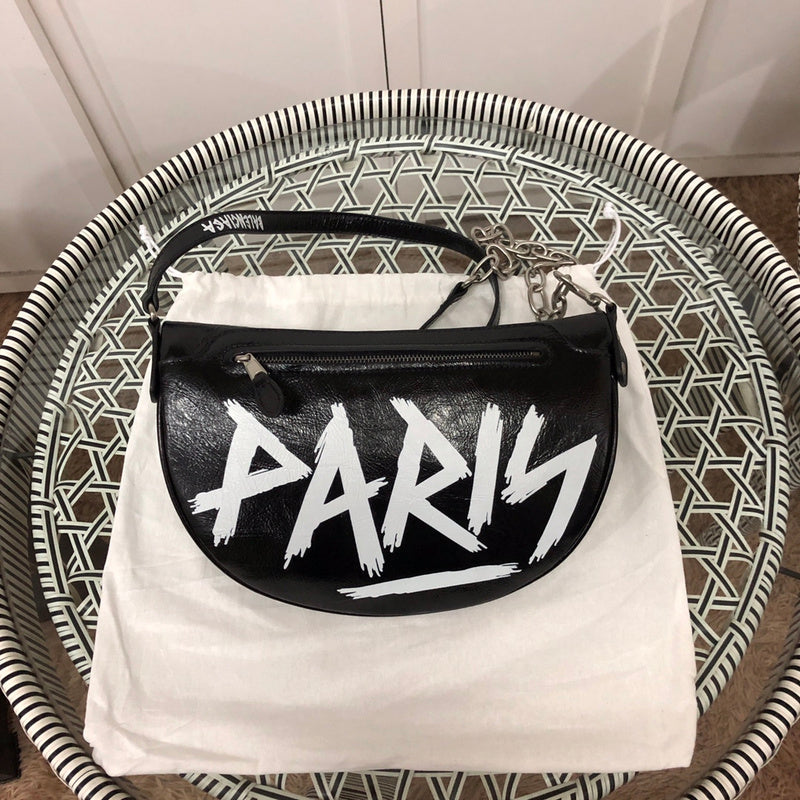 Front view of sleek structured women's handbag – women's luxury handbag