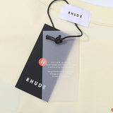 Close-up detail shot of Rhude luxury clothing with contemporary cut