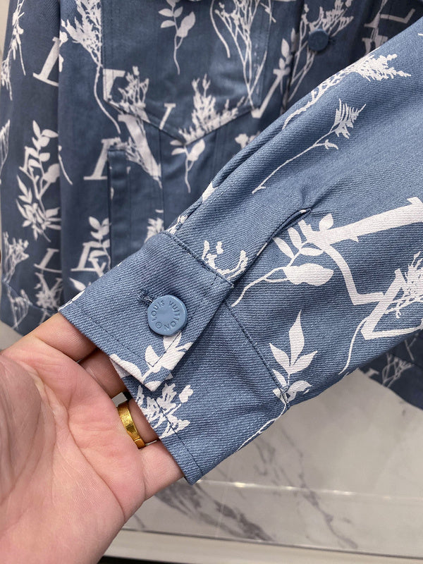 Flat lay presentation of Louis Vuitton luxury clothing with label-forward styling