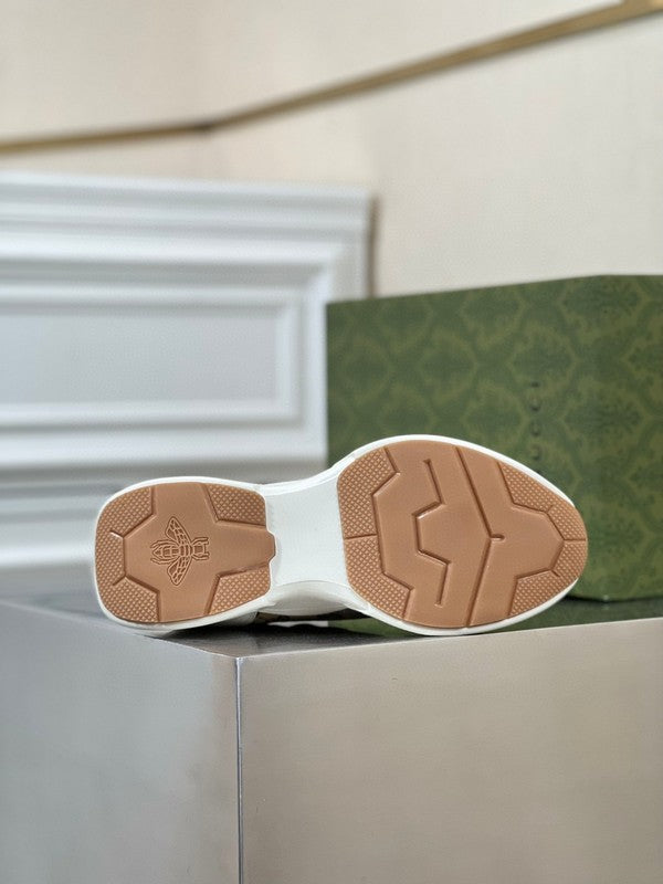 Side profile of Gucci stone beige sneakers classic court silhouette