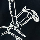 Flat lay presentation of Louis Vuitton luxury clothing with label-forward styling