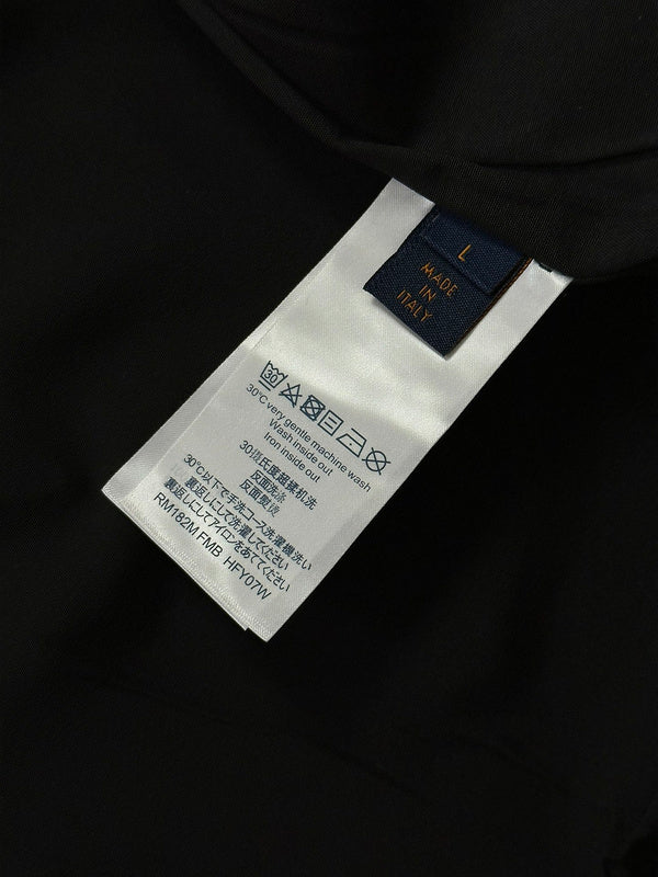 Back view of Louis Vuitton luxury clothing with label-forward styling