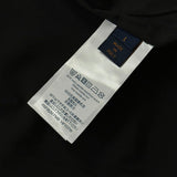 Back view of Louis Vuitton luxury clothing with label-forward styling