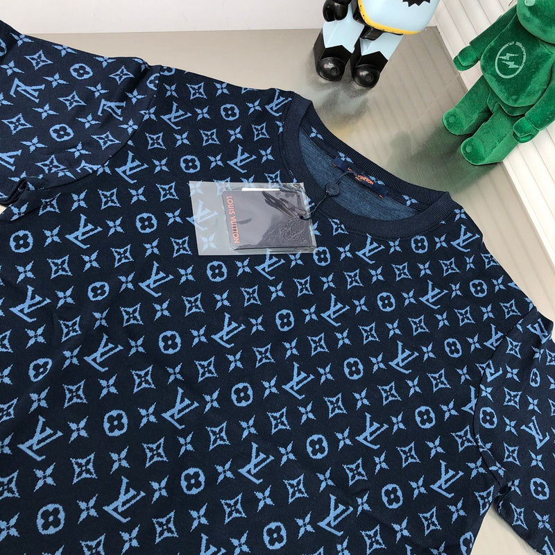 Close-up detail shot of Louis Vuitton cotton t-shirt with label-forward styling