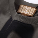 Close-up detail shot of Gucci luxury clothing with tailored silhouette