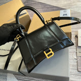 Front view of sleek classic women's handbag – women's designer-style accessory