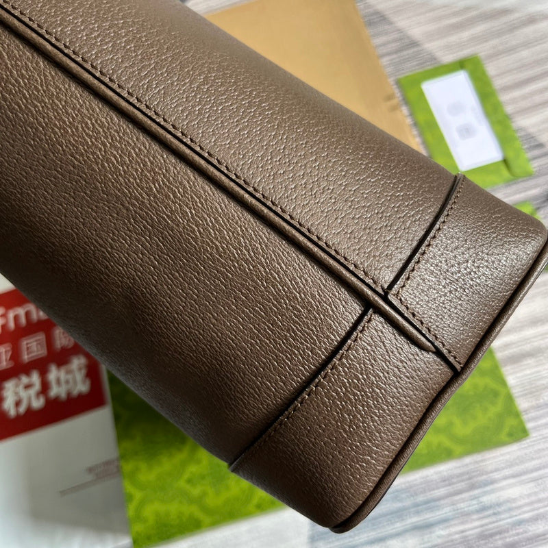 Handle and strap detail of polished modern women's handbag – women's luxury accessory