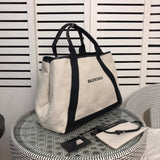 Front view of refined modern women's handbag – women's luxury accessory