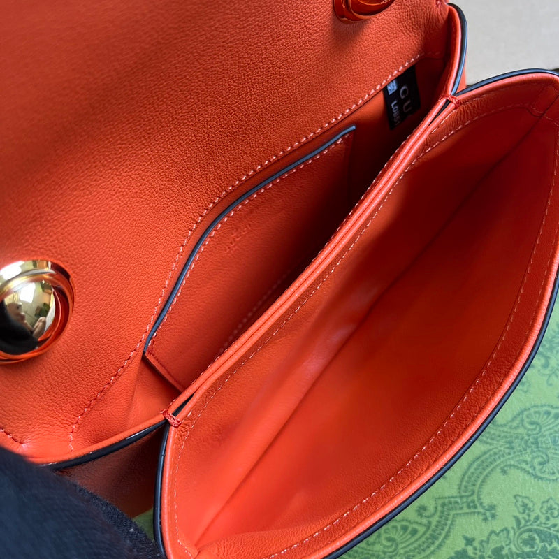 Side profile of sleek signature women's handbag – women's luxury accessory