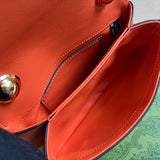 Side profile of sleek signature women's handbag – women's luxury accessory