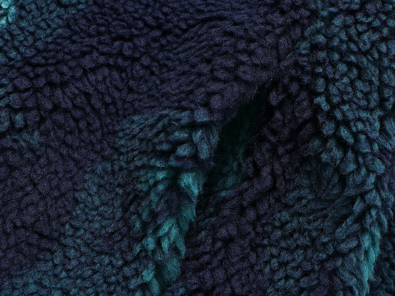 Close-up detail shot of Louis Vuitton luxury clothing with monogram-inspired silhouette