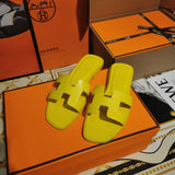 Hermès Beige Flat Thong Sandals - Lifestyle Styling Shot