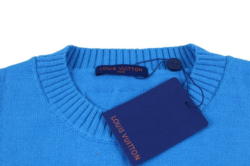 Close-up detail shot of Louis Vuitton luxury clothing with logo-detail design