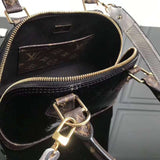 Handle and strap detail of everyday-luxe premium women's handbag – women's luxury handbag