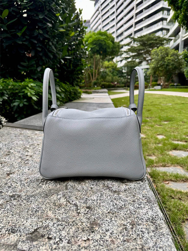 Side view of minimalist structured handbag