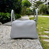 Side view of minimalist structured handbag