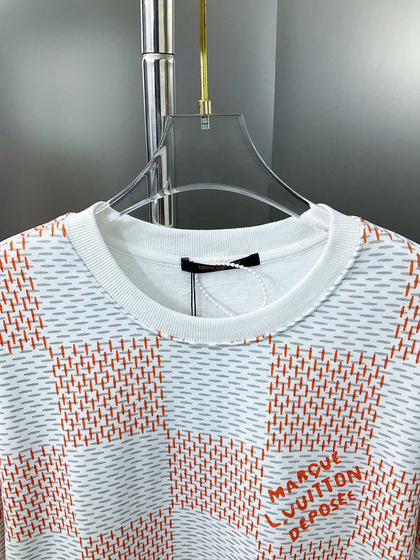 Close-up detail shot of Louis Vuitton luxury clothing with label-forward styling